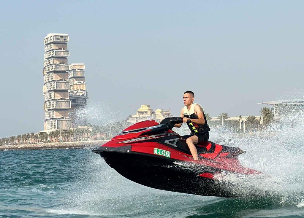 One man riding jet ski.